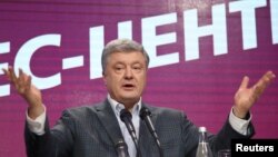 FILE - Ukraine's president and presidential candidate Petro Poroshenko delivers a speech following the announcement of the first exit poll in a presidential election at his campaign headquarters in Kyiv, Ukraine, March 31, 2019.