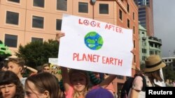 FILE - Protesters demanding action on climate change gather at Te Ngakau Civic Square in Wellington, New Zealand, March 15, 2019. 