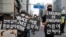 FILE - People march on the street in solidarity with protests against the death in Minneapolis police custody of George Floyd, in Seoul, South Korea, June 6, 2020. 