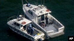 Image réalisée à partir d'une vidéo montrant les secours à Hawkesbury River, après le crash d'un hydravion, Nouvelle-Galles du Sud, Australie, 31 décembre 2017.