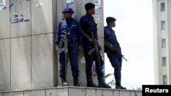 Congolese policemen take positions near Congo's Independent National Electoral Commission (CENI) headquarters in Kinshasa, Democratic Republic of Congo, Jan. 9, 2019. 