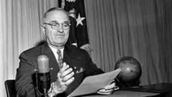 President Harry Truman at the White House, September 1st, 1945, preparing to broadcast a message on the official surrender of Japan