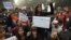 Indian students carrying placards shout slogans against last week's gang-rape as they protest in central New Delhi, India, Dec. 24, 2012.