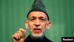 Afghan President Hamid Karzai speaks during a news conference in Kabul, Jan. 25, 2014. 