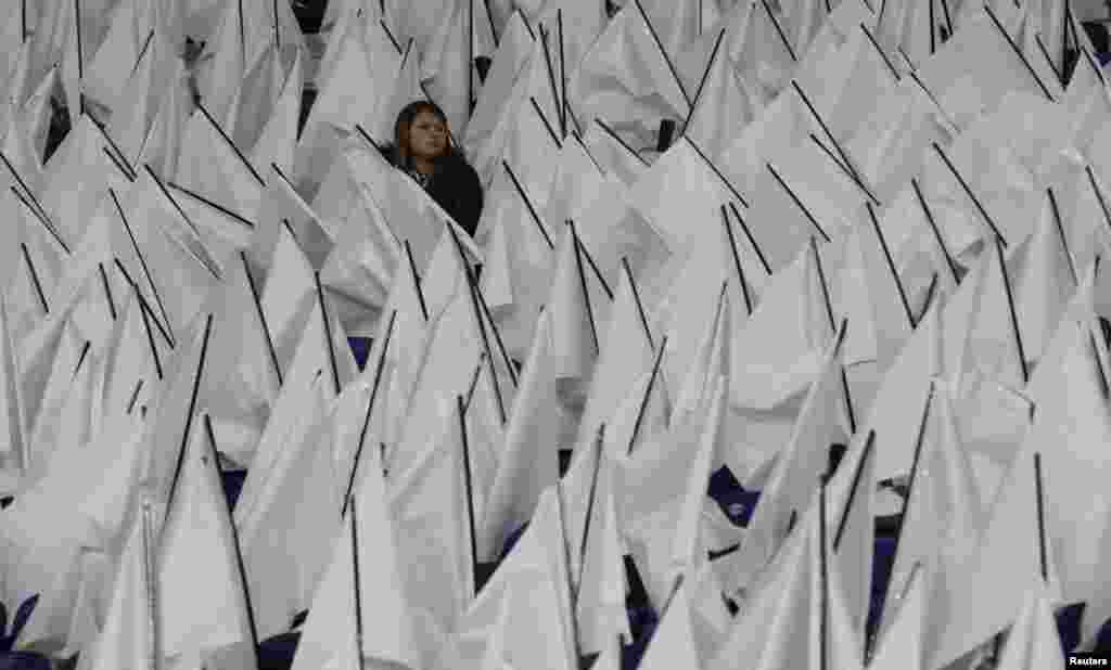 A fan waits for the start of the UEFA Champions League round of the 16-second leg between Leicester City and Sevilla, at King Power Stadium in Leicester, England, March 14, 2017. 