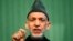 FILE - Afghan President Hamid Karzai speaks during a news conference in Kabul, Jan. 25, 2014. 