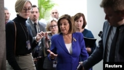U.S. House Speaker Nancy Pelosi answers questions from reporters after leaving a House Democratic caucus meeting on Capitol Hill in Washington, Jan. 8, 2020. 