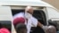 FILE - Sudan's ousted President Omar al-Bashir disembarks from a vehicle upon arriving at the courthouse to attend his trial, in the capital Khartoum, in this AFPTV screen grab from footage aired July 21, 2020. 
