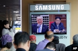 FILE - A TV screen shows images of U.S. President Donald Trump, left, and North Korean leader Kim Jong Un during a news program at the Seoul Railway Station in Seoul, South Korea, May 2, 2017. Chinese observers say China cannot afford to get too entangled in the antagonism created by the U.S. to invite retaliation from Kim.