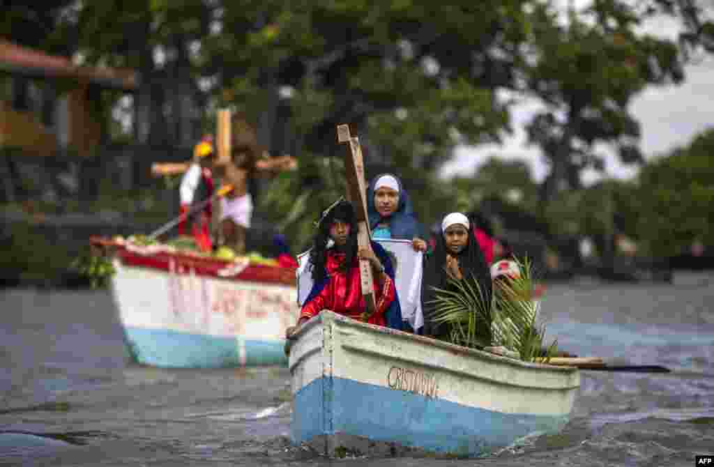 Catholic faithful take part in the aquatic re-enactment of the Way of the Cross on Lake Cocibolca, or Lake Nicaragua, in Granada, some 48 km southeast of Managua, Nicaragua, March 29, 2021, amid Holy Week celebrations.