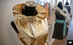 In this Oct. 4, 2017 photo, a TWA disposable paper uniform worn by flight attendants, is displayed at an installation of retro items at the company's meeting space in One World Trade Center in New York.