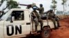 FILE - In this photo taken May 26, 2017, U.N. peacekeepers patrol outside Bria, Central African Republic. The United Nations said at the time that about 300 people had been killed and 200 wounded in the previous two weeks in Bria and a handful of other towns.