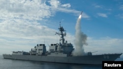 Sailors aboard the guided-missile destroyer USS Preble (DDG 88) conduct an operational tomahawk missile launch in a training area off the coast of California in this September 29, 2010 file photograph and released to Reuters on March 19, 2011. 