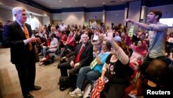 Matthew Schoenberger, of New Orleans, shouts a question at Republican U.S. Senator Bill Cassidy during a town hall meeting in Metairie, Louisiana, Feb. 22, 2017.