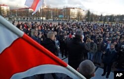 FILE - People shout slogans at a rally in the city of Maladzyechna, Belarus, March 10, 2017.