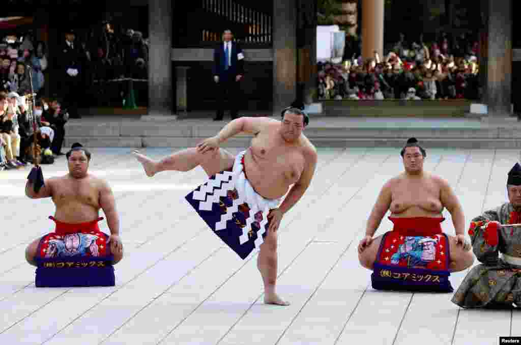 Japanese grand sumo champion Yokozuna Kisenosato performs the New Year's ring-entering rite at the annual celebration for the New Year at Meiji Shrine in Tokyo.