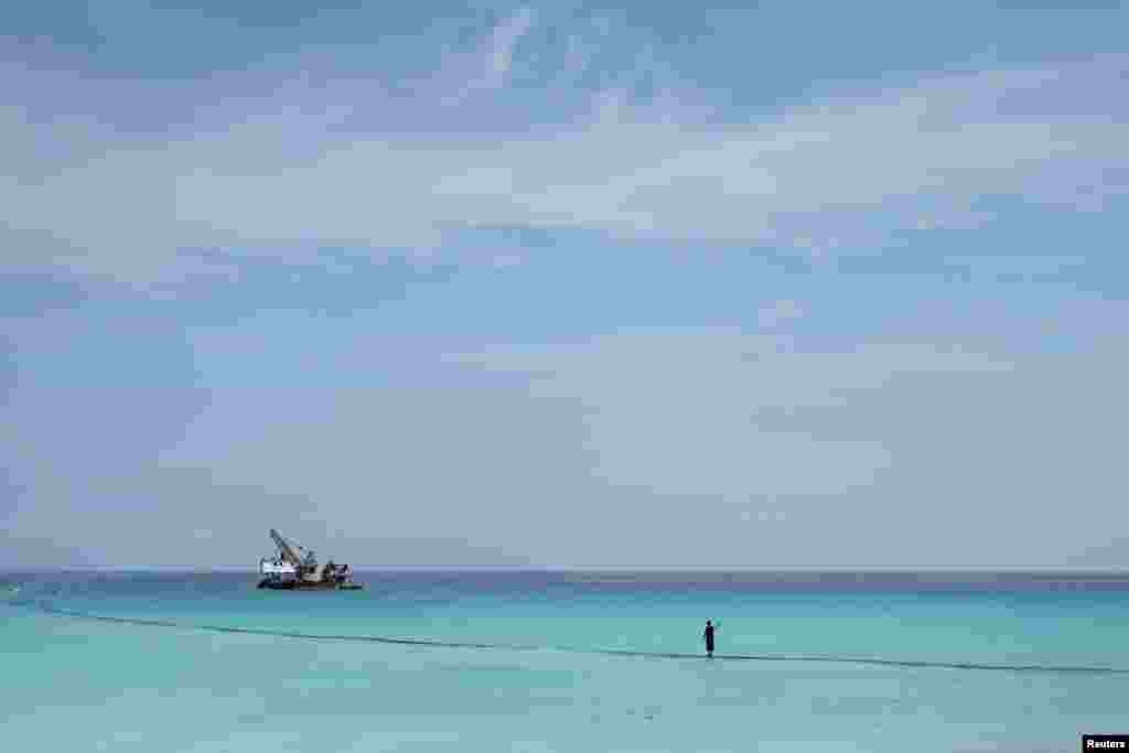 A man fishes on the beach in Varadero, Cuba.