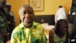 Gbagbo and wife Simone sit in a room at Hotel Golf after they were arrested, Abidjan, April 11, 2011.