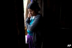 Catarina Alonzo Perez, mother of the second Guatemalan child this month to die while in U.S. custody, stands in her kitchen in Yalambojoch, Guatemala, Dec. 29, 2018.