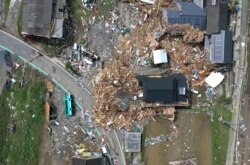 Kerusakan akibat banjir yang dipicu oleh hujan lebat, di Kumamura, Prefektur Kumamoto, Jepang barat daya, 8 Juli 2020. Foto diambil dengan drone. (REUTERS / Kim Kyung-Hoon)
