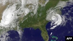This May 10, 2015, NOAA satellite photo shows Tropical Storm Ana(R) off the Carolinas in the US. Tropical storm Ana made landfall on the US southeastern coast Sunday, risking flooding, high winds and life-threatening tides in the region, forecasters warned.