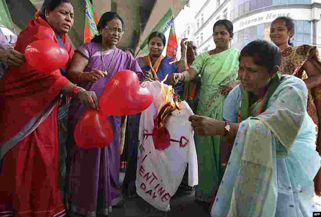 Activists from the Bharatiya Janata Party burn an effigy representing Valentine's Day during an anti-Valentine's Day protest in the southern Indian city of Hyderabad February 14, 2012. (REUTERS)