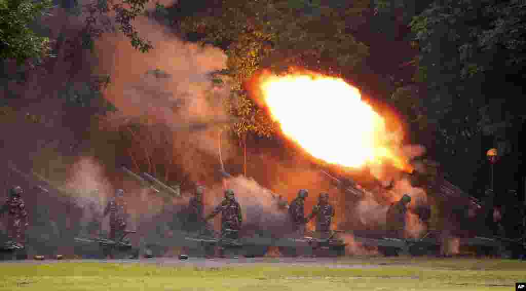 Army troops fire their 105mm Howitzer to welcome President Rodrigo Duterte as he arrives for the turnover of command ceremony for the new Army Chief Maj.Gen. Rolando Joselito Bautista Thursday, Oct. 5, 2017 in Fort Bonifacio in suburban Taguig city east of Manila, Philippines.