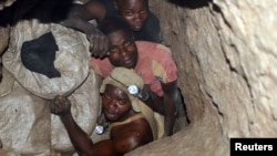 FILE - Congolese diggers work in an improvised mine near the town of Kambove, April 17, 2007. 