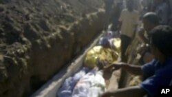 This image made from amateur video on July 13, 2012 purports to show a funeral for victims killed by violence that, according to anti-regime activists, was carried out by government forces in Tremseh, Syria.