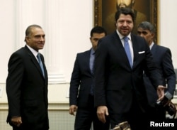 FILE - Pakistan's Foreign Secretary Aizaz Ahmad Chaudhry (L) and Afghanistan's Deputy Foreign Minister Hekmat Khalil Karzai (2nd R) arrive for a meeting in Kabul, Afghanistan, Jan. 18, 2016.
