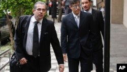 State prosecutors Jose Carlos Blat, left, Cassio Roberto Conserino, center, and Fernando Henrique de Moraes Araujo, responsible for the charges against Brazil's former President Luiz Inacio Lula da Silva, arrive for a press conference. 