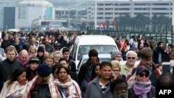 Passengers are evacuated from Brussels airport, on March 22, 2016 in Zaventem, after at least 13 people were killed and 35 injured as twin blasts rocked the main terminal of Brussels airport.