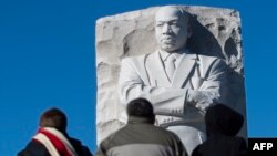 People visit the Martin Luther King Jr. Memorial in Washington, DC on Martin Luther King Day on January 21, 2019. (Photo by Andrew CABALLERO-REYNOLDS / AFP)