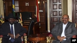 President of the Government of Southern Sudan, Salva Kiir Mayardit, left, with Sudan President Omar al-Bashir in Juba, South Sudan, April 2011.