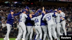 Los Angeles Dodgers players and coaches celebrate after winning the 2024 MLB World Series against the New York Yankees at Yankee Stadium, October 30, 2024. (Vincent Carchietta-Imagn Images)