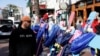 Two days after a U.S. Army veteran drove his truck into the crowded French Quarter on New Year's Day, Raymond Cruz of Tampa, Florida, looks at wooden crosses bearing the photos of victims who were killed, in New Orleans, Louisiana, Jan. 3, 2025.