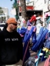 Two days after a U.S. Army veteran drove his truck into the crowded French Quarter on New Year's Day, Raymond Cruz of Tampa, Florida, looks at wooden crosses bearing the photos of victims who were killed, in New Orleans, Louisiana, Jan. 3, 2025.