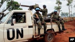 FILE - U.N. peacekeepers patrol outside Bria, Central African Republic, May 26, 2017.