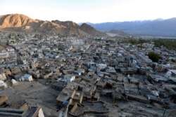 FILE - The sun sets in Leh, the largest town in the region of Ladakh, nestled high in the Indian Himalayas, India, Sept. 26, 2016.