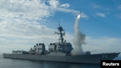 Sailors aboard the guided-missile destroyer USS Preble (DDG 88) conduct an operational tomahawk missile launch in a training area off the coast of California in this September 29, 2010 file photograph and released to Reuters on March 19, 2011. 