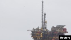 FILE - Shell's Brent Delta oil platform is towed into Hartlepool, Britain, May 2, 2017. 