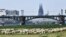 A flock of sheep graze at the river Rhine near the Cathedral in Cologne, Germany, April 27, 2020.