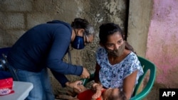 A child is vaccinated in Barcelona, Anzoategui State, Venezuela, on March 16, 2021. 