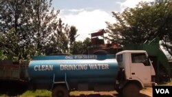 Large trucks transport clean water from the Nyamasaria Water Works in Kisumu, Kenya to customers (VOA/A. Khayesi) 