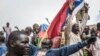 Russians and Malian flags are waved by protesters in Bamako during a demonstration against French influence in the country on May 27, 2021. (Michele Cattani/AFP)