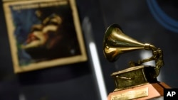 Ella Fitzgerald's Grammy for best female vocal performance, awarded in 1958, is displayed at a sneak preview of "Ella at 100: Celebrating the Artistry of Ella Fitzgerald" at The Grammy Museum at L.A. Live, April 24, 2017, in Los Angeles.