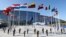 FILE - Flags of NATO member countries fly at the new NATO headquarters in Brussels, Belgium.