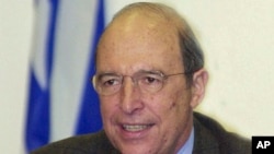 FILE - Greece's Prime Minister Costas Simitis declares a razor-thin victory over conservative opponents following general elections, in Athens, April 10, 2000.