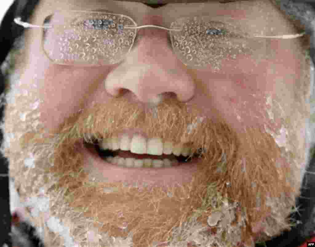 Rob Sobak, of Brunswick, Maine, with glasses iced up and beard bearing icicles, braved the wintry weather as he made his way along a road in Brunswick, Maine, on Monday, Dec. 27, 2010. The weather service reported that coastal areas of the state received