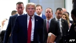 FILE - Former U.S. President Donald Trump departs for a break during the civil fraud trial against the Trump Organization, at the New York State Supreme Court in New York City on December 7, 2023.